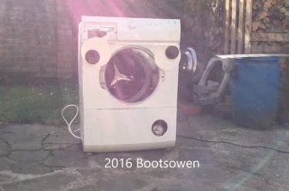 A Washing Machine With Googly Eyes Gets The Brick Treatment