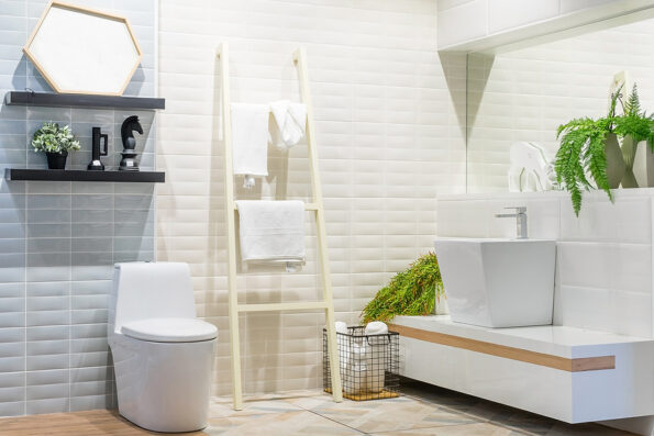 White urinal and washbasin and shower in granite bathroom, Modern house bathroom interior, luxury bathroom