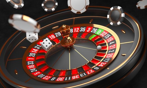 Casino background. Luxury Casino roulette wheel on black background. Casino theme. Close-up black casino roulette with a ball, chips and dice. Poker game table. 3d rendering illustration.