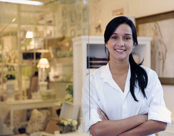 portait of small business owner: proud woman and her store