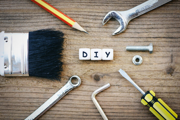 diy tools concept / Working tools with wrench screwdriver nuts and bolts paint brush and DIY blog on wooden