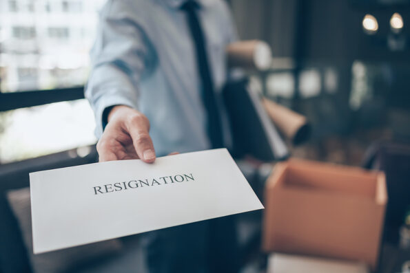 Businessman sending and showing resignation letter to employer boss. Quitting a job, businessman fired or leave a job concept. termination