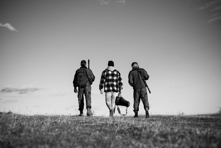 Hunting. Hunter with shotgun gun on hunt. Hunting Gear and Hunting Clothing.