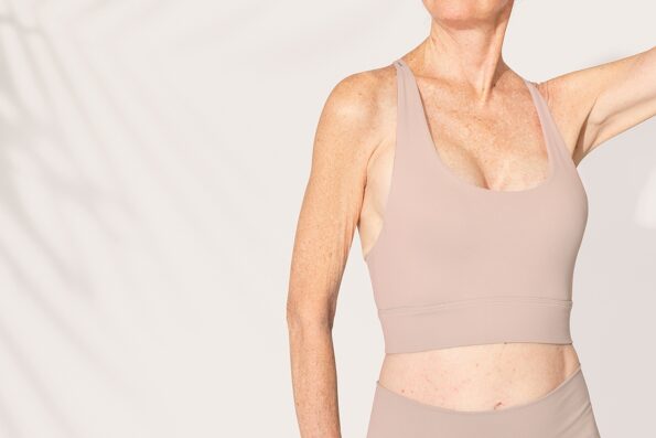 Women's beige sports bra senior activewear with design space close up