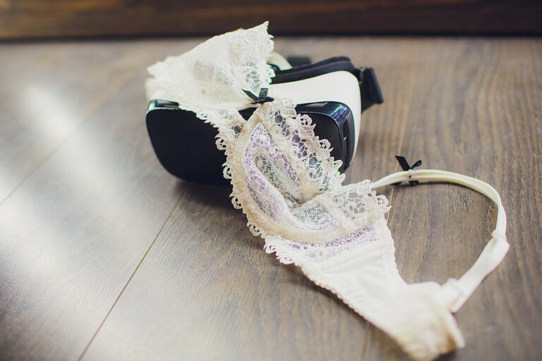 female, bra on a black sheet, virtual reality vr technology used for porn vr video in adult entertainment. home