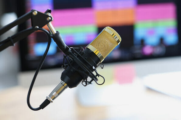 Professional sound recording studio with microphone and speaker. Audio voiceover or video recording concept.