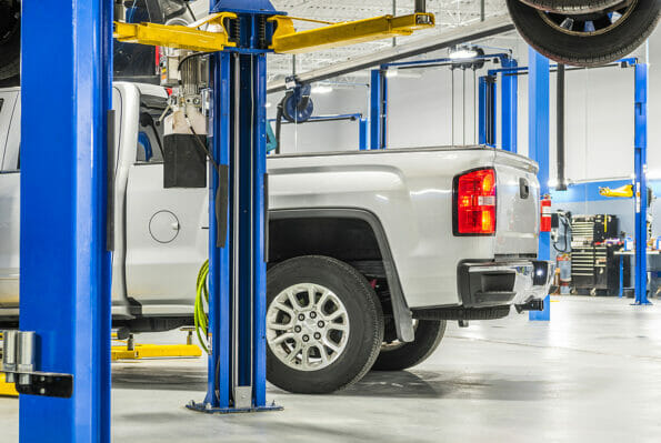 Certified Auto Service, Repair and Maintenance Automotive Theme. Modern Pickup Truck Inside the Service.