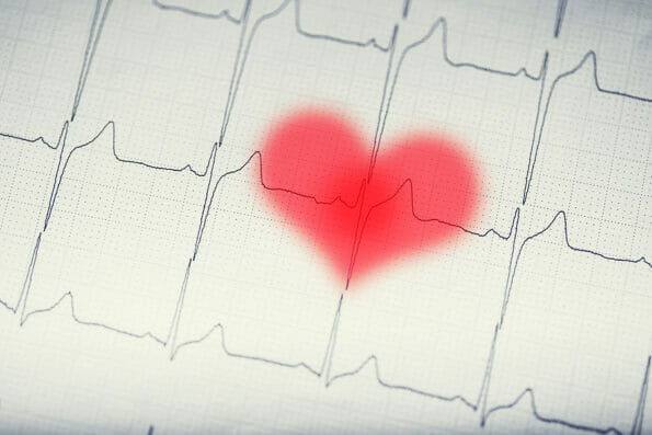 EKG graph.Electrocardiogram ekg ecg with red blurred heart.