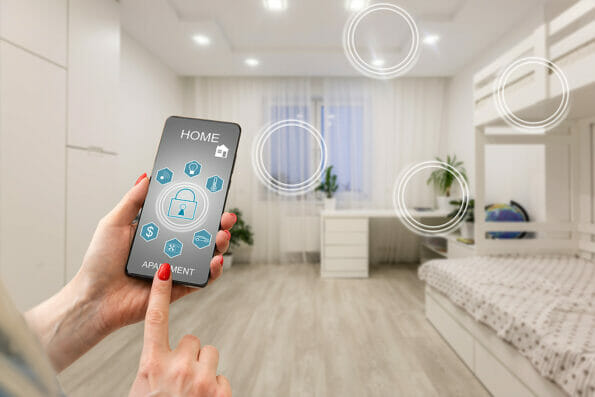 Controlling home heating temperature with a smart home, close-up on phone. Concept of a smart home and mobile application for managing smart devices at home