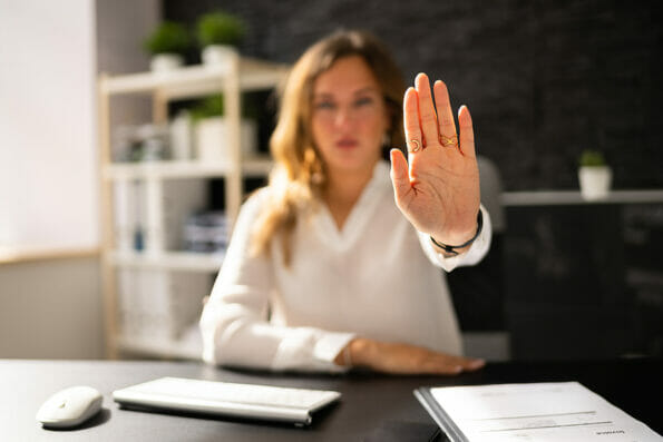 Business Woman In Office In Stress And Despair. Stop Hand Gesture