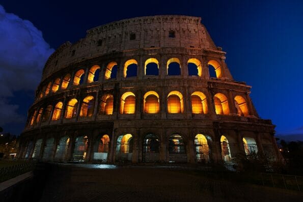 rome, italy, colosseum old ancient building gladiator battle at night