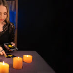 The fortune teller or Psychic with Laptop Computer, Online astrology. Reading tarot cards. Online Psychic concept
