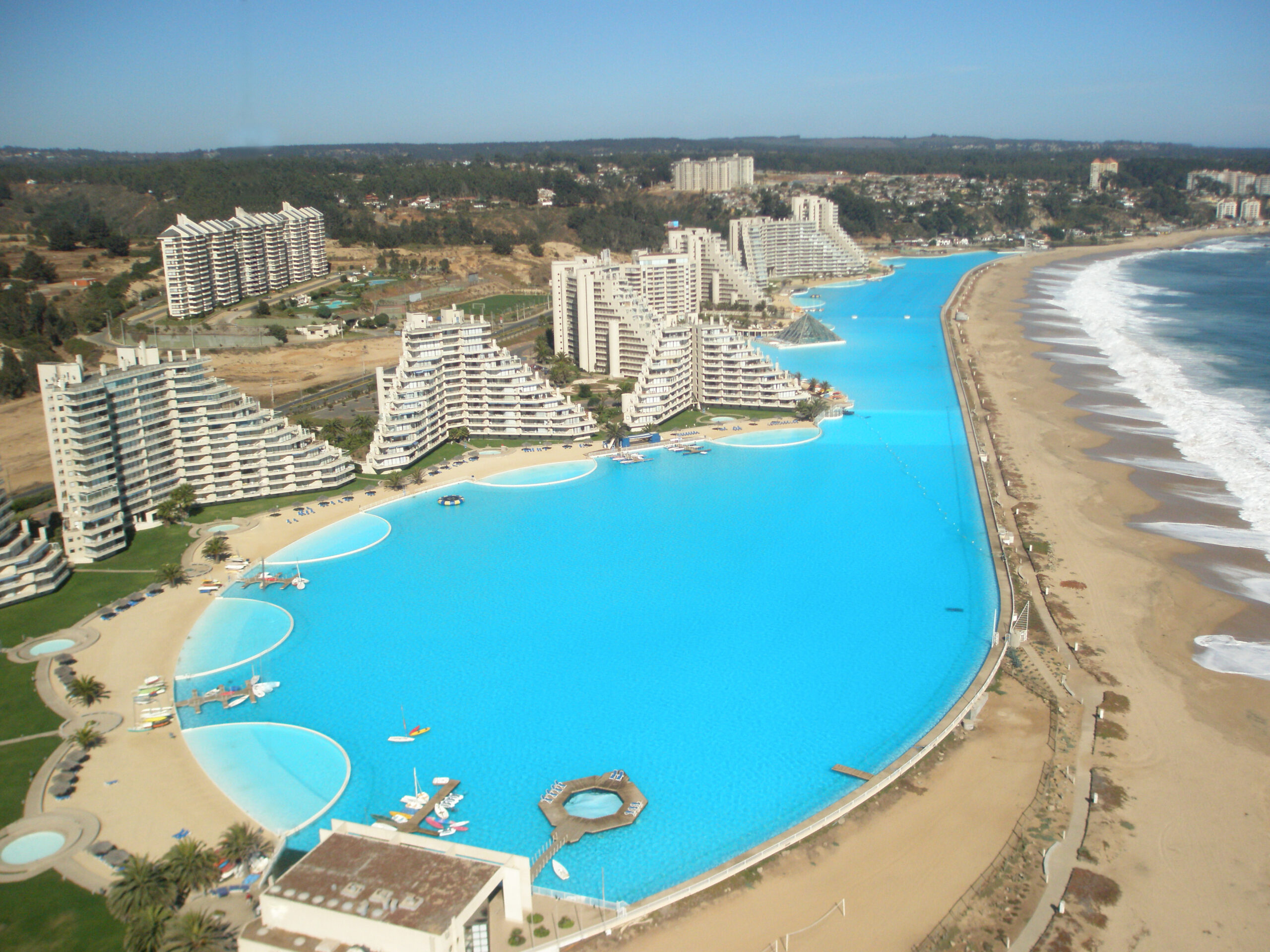 Arial view of San Alfonso del Mar Pool showcasing a blue lagoon that spans along the ocean