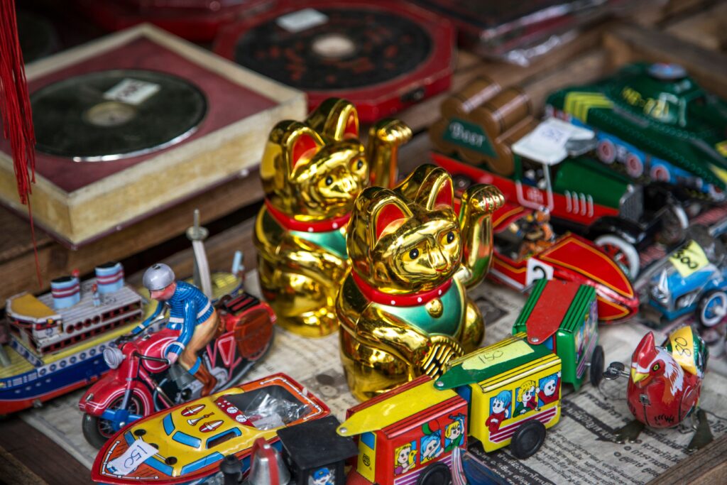 Table surrounded by assortment of Japanese toys